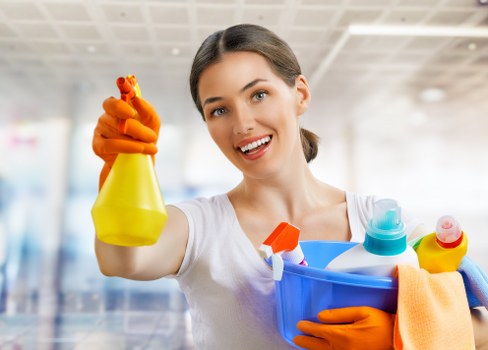 Professional stain removal cleaning a carpet in Upper Clapton