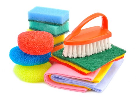 Vacuuming a mattress to remove dust and allergens